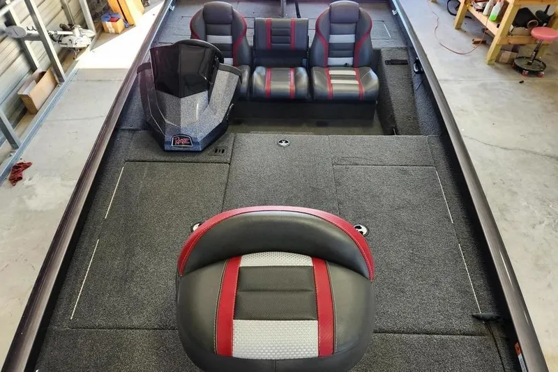 Slide: The Image of 2006 Sea Hunt Escape 200 boat interior with steering wheel and navigation equipment. - 9