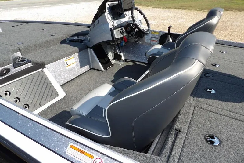Slide: The Image of 2023 Nitro Z19 boat interior with sleek seating and modern dashboard design. - 10