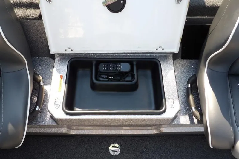 Slide: The Image of 2023 Nitro Z19 boat storage compartment with electronic device inside. - 14