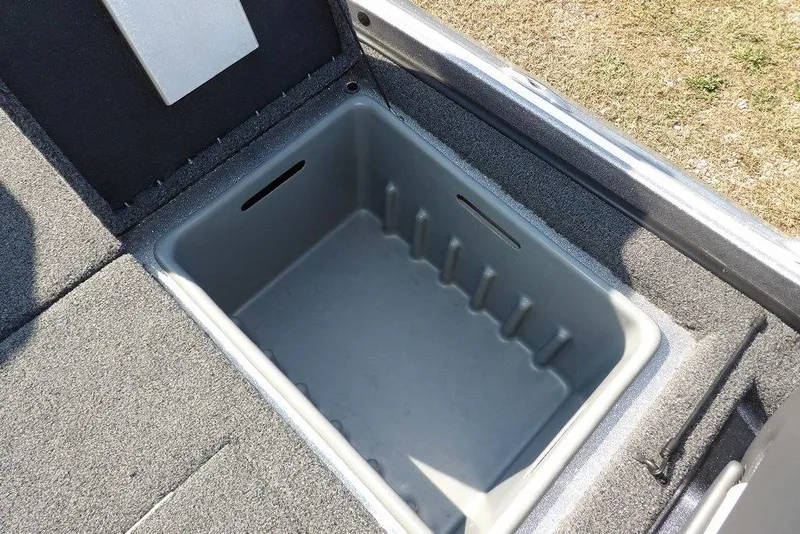 Slide: The Image of 2023 Nitro Z19 boat storage compartment with open lid, showing spacious interior. - 15