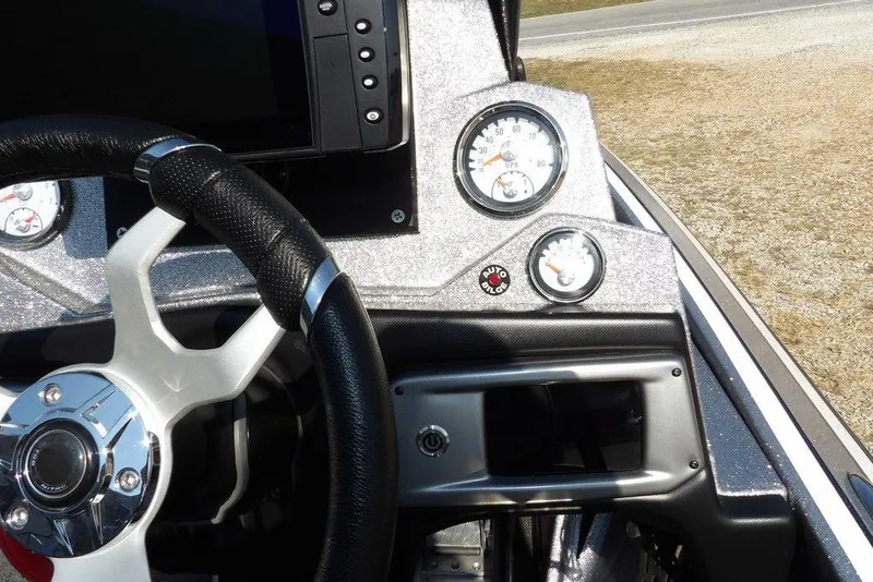 Slide: The Image of Dashboard of a 2023 Nitro Z19 boat featuring steering wheel and gauges. - 22