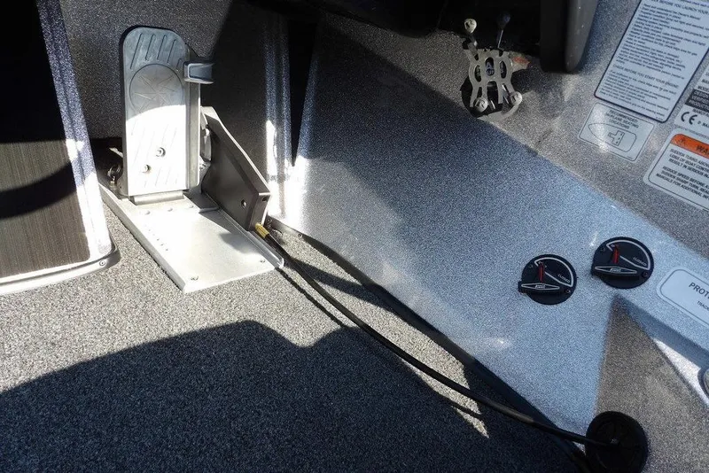 Slide: The Image of 2023 Nitro Z19 boat interior with foot pedal and control switches. - 23