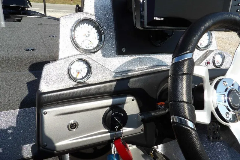 Slide: The Image of 2023 Nitro Z19 boat dashboard with steering wheel and gauges. - 24