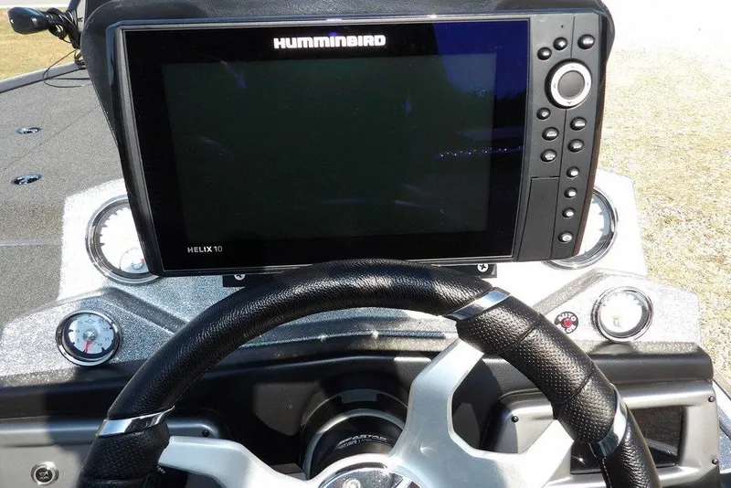 Slide: The Image of Steering wheel and Humminbird Helix 10 display on 2023 Nitro Z19 boat dashboard. - 26