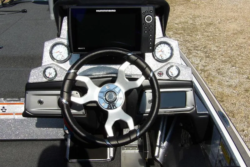 Slide: The Image of 2023 Nitro Z19 boat dashboard with steering wheel and electronic display. - 27