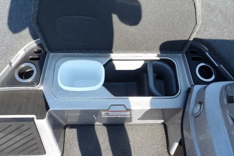 Slide: The Image of 2023 Nitro Z19 boat interior with cup holders and storage compartments. - 31