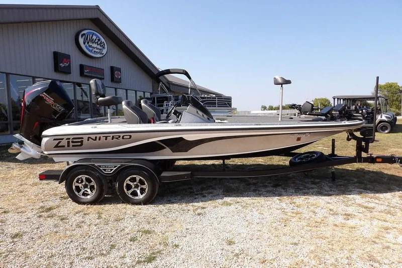 Slide: The Image of 2023 Nitro Z19 boat on trailer outside White's Marine Center. - 4