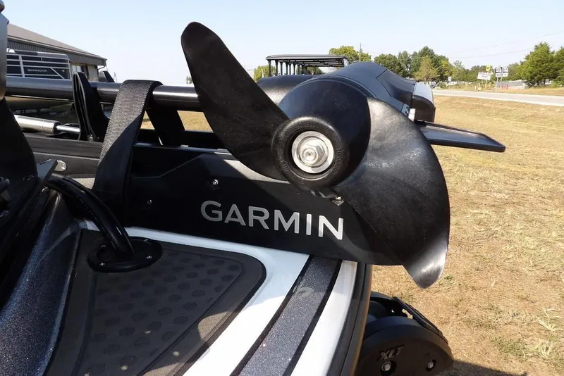 Slide: The Image of 2023 Nitro Z19 boat with Garmin trolling motor on grassy area. - 40