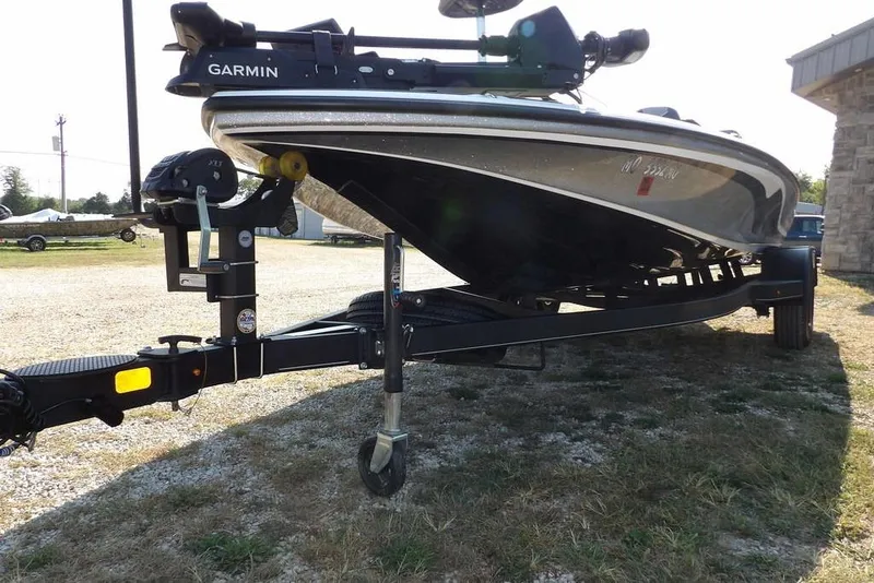 Slide: The Image of 2023 Nitro Z19 boat on trailer with Garmin equipment, parked outdoors. - 43