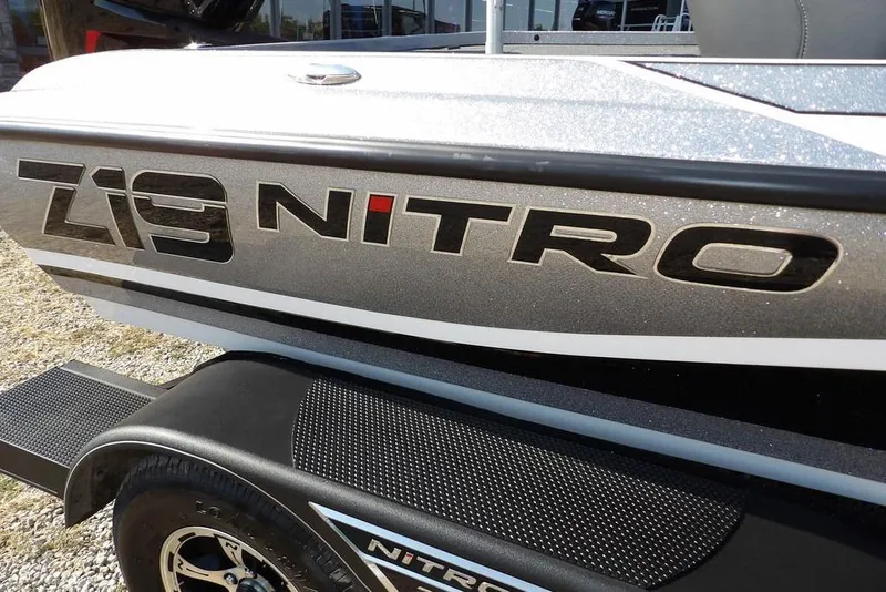 Slide: The Image of 2023 Nitro Z19 boat side view with logo and trailer detail. - 44