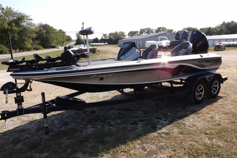 Slide: The Image of 2023 Nitro Z19 boat on trailer, parked outdoors, featuring Garmin equipment. - 5