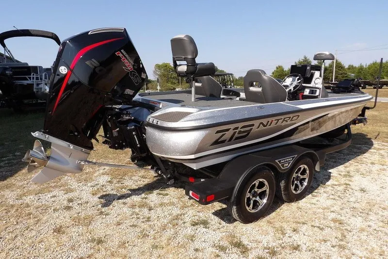 Slide: The Image of 2023 Nitro Z19 boat with powerful outboard motor on a dual-axle trailer. - 7
