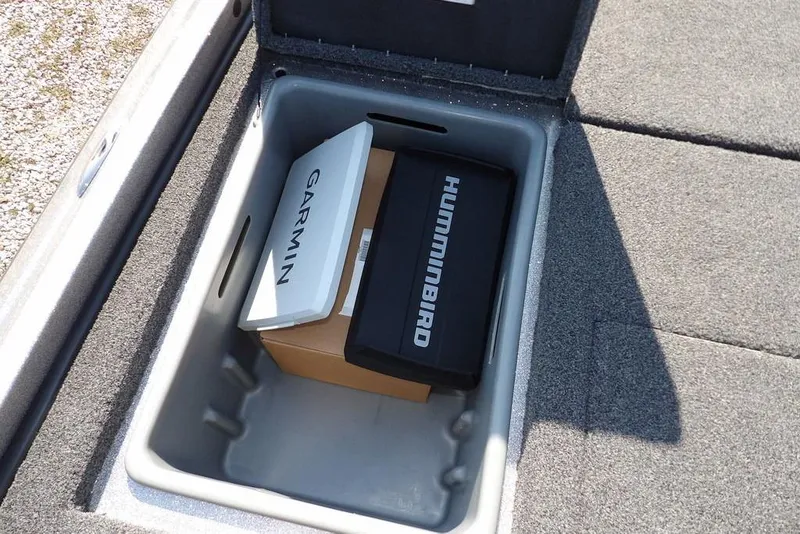 Slide: The Image of Storage compartment in 2023 Nitro Z19 boat with Garmin and Humminbird equipment. - 9