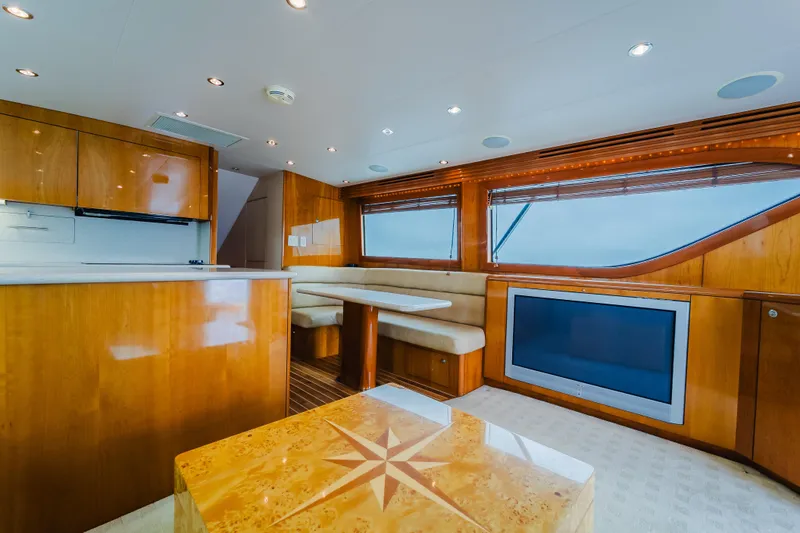 Slide: The Image of Luxurious interior of 2005 Hatteras Convertible 60 yacht with wood finishes and modern amenities. - 14