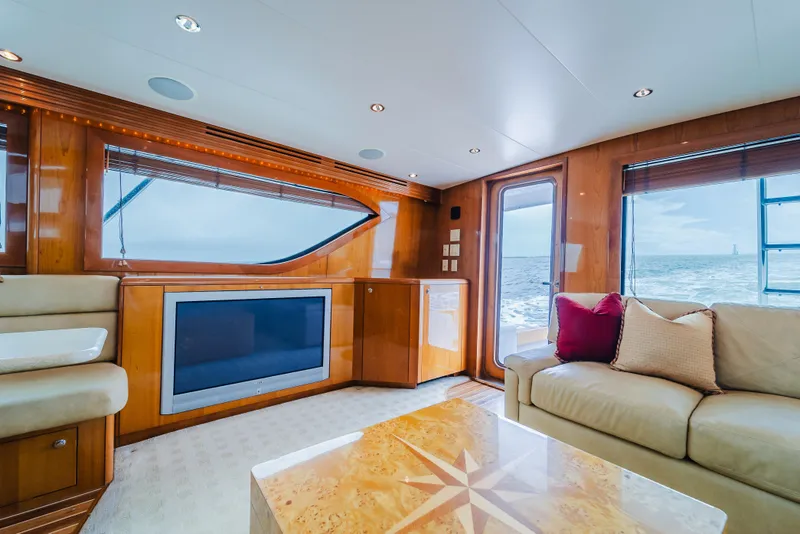 Slide: The Image of Luxurious interior of 2005 Hatteras Convertible 60 yacht with ocean view and elegant furnishings. - 15