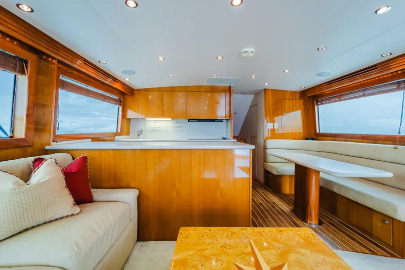 Slide: The Image of Luxurious interior of 2005 Hatteras Convertible 60 yacht with elegant wood finishes. - 19