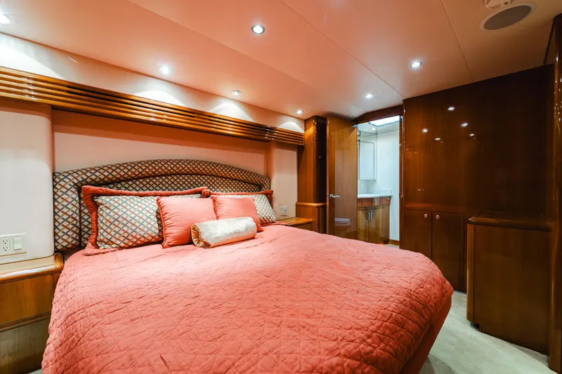 Slide: The Image of Luxurious bedroom interior of 2005 Hatteras Convertible 60 yacht with elegant wood finishes. - 25