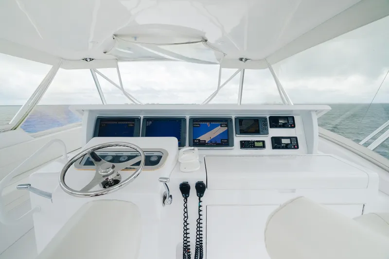 Slide: The Image of 2005 Hatteras Convertible 60 yacht helm with navigation equipment and ocean view. - 37