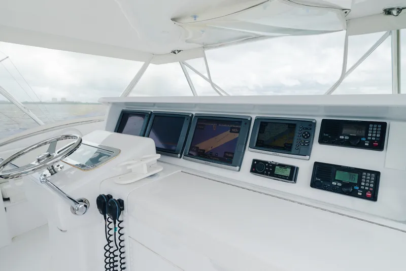 Slide: The Image of Helm of 2005 Hatteras Convertible 60 yacht with advanced navigation systems. - 38