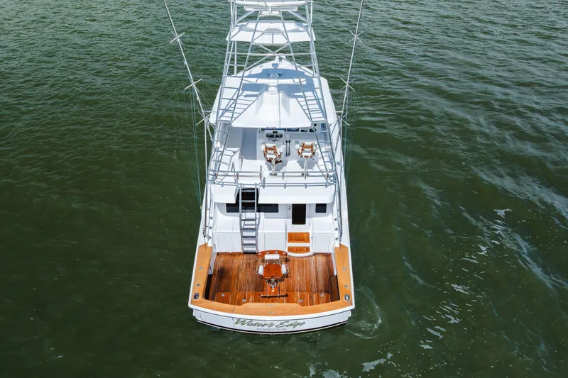 Slide: The Image of Aerial view of 2005 Hatteras Convertible 60 yacht on open water. - 4