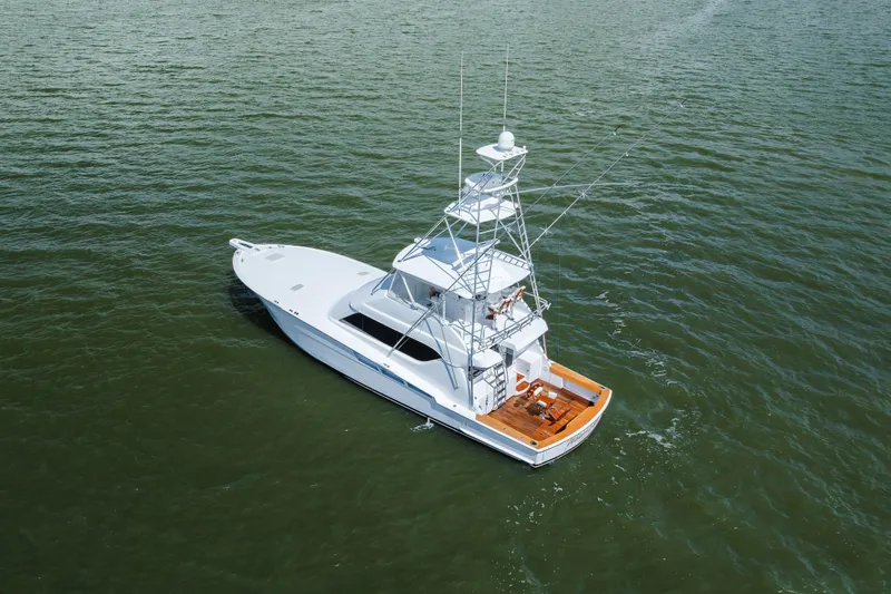 Slide: The Image of 2005 Hatteras Convertible 60 yacht on open water, aerial view. - 57