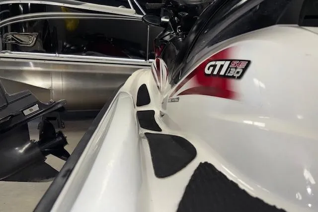 Slide: The Image of 2008 Sea-Doo GTI SE 130 jet ski in storage, close-up view. - 7