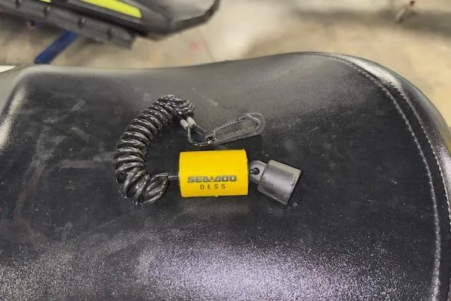 Slide: The Image of Yellow Sea-Doo DESS key on black seat, 2008 GTI SE 130 model. - 9