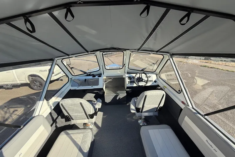 Slide: The Image of Interior of 2026 Thunder Jet 185 Luxor boat with seating and steering console. - 12