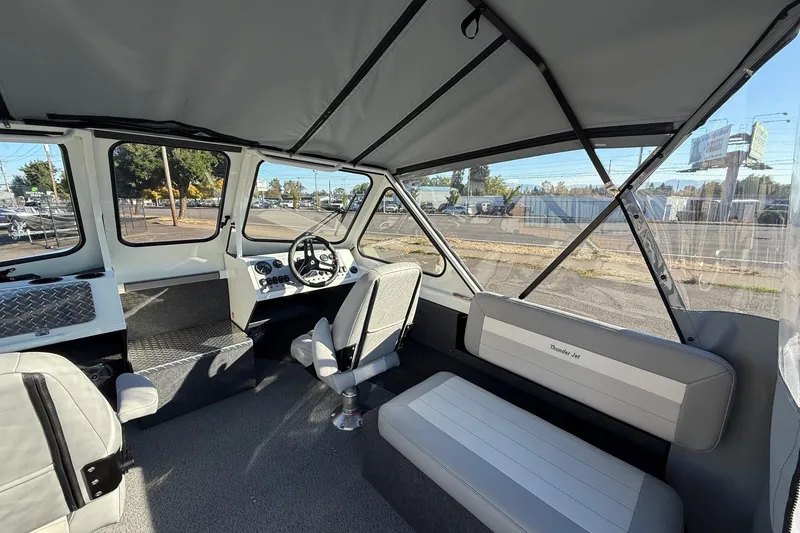 Slide: The Image of Interior of 2026 Thunder Jet 185 Luxor boat with seating and steering wheel. - 13