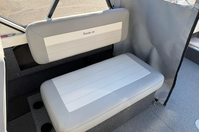 Slide: The Image of 2026 Thunder Jet 185 Luxor boat interior with gray seating and cup holders. - 14