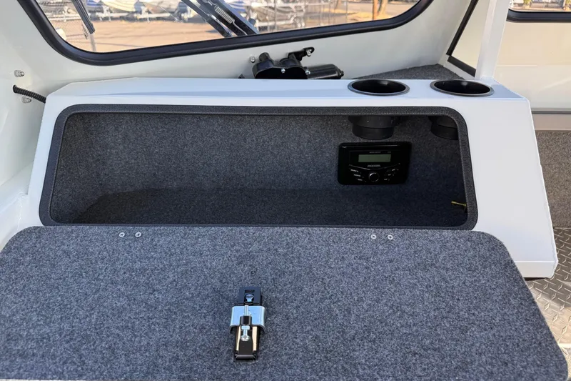 Slide: The Image of Interior of 2026 Thunder Jet 185 Luxor boat with storage compartment and audio system. - 20