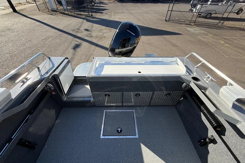Slide: The Image of 2026 Thunder Jet 185 Luxor boat interior with storage compartments and motor. - 23