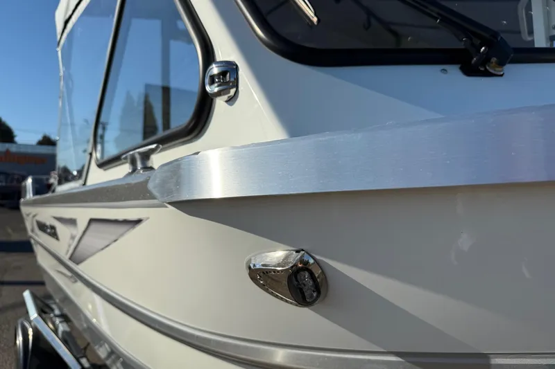 Slide: The Image of Close-up of 2026 Thunder Jet 185 Luxor boat exterior, showcasing sleek design and metallic finish. - 7