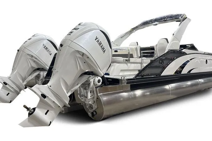 Slide: The Image of 2025 Bennington 27QXSBWAT2 pontoon boat with dual Yamaha outboard engines. - 2