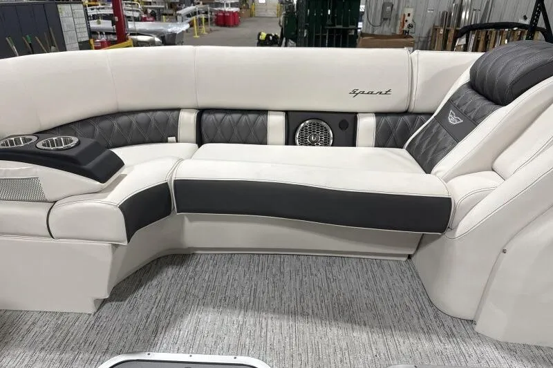 Slide: The Image of Luxurious seating on 2025 Bennington 27QXSBWAT2 boat, featuring elegant upholstery and cup holders. - 6