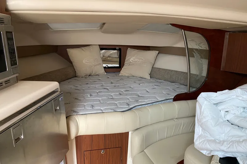 Slide: The Image of Luxurious cabin interior of 2022 Grady-White Express 370 boat with cozy bedding. - 10