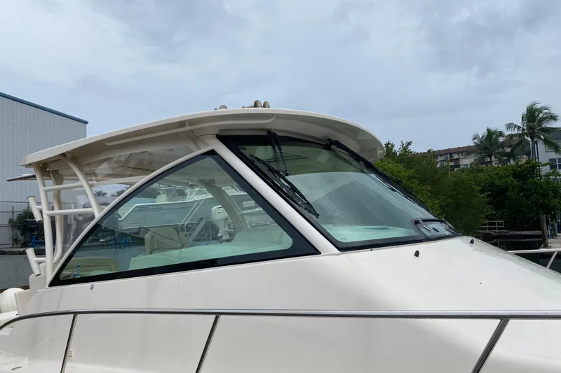 Slide: The Image of 2022 Grady-White Express 370 boat with sleek design, docked outdoors. - 2