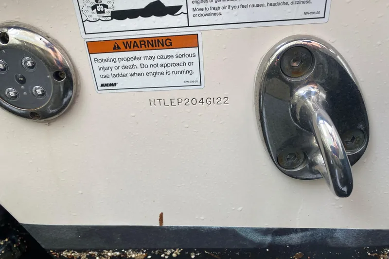 Slide: The Image of 2022 Grady-White Express 370 boat warning label and hardware detail. - 24