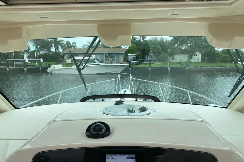 Slide: The Image of Interior view from a 2022 Grady-White Express 370 boat, overlooking a serene waterfront. - 3