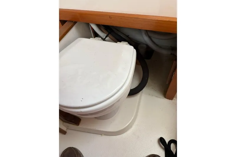 Slide: The Image of Boat bathroom with toilet in 2005 Carolina Classic 25 model. - 11