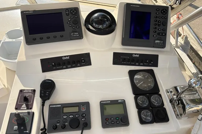 Slide: The Image of Control panel of a 2005 Carolina Classic 25 boat with navigation instruments. - 14