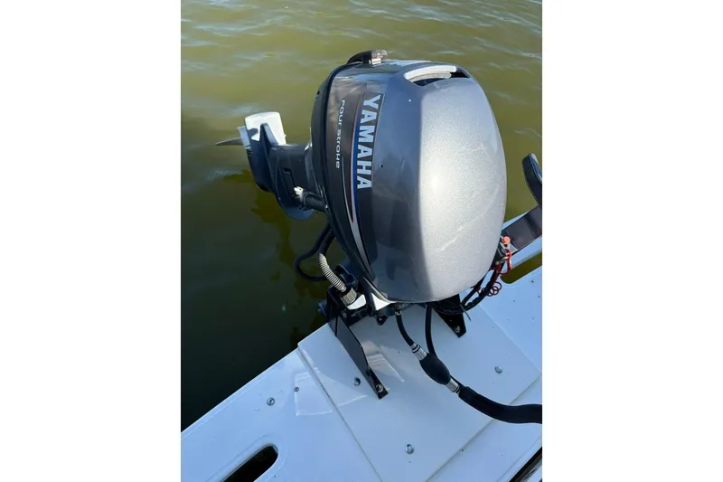 Slide: The Image of Yamaha outboard motor on 2005 Carolina Classic 25 boat, floating on water. - 9
