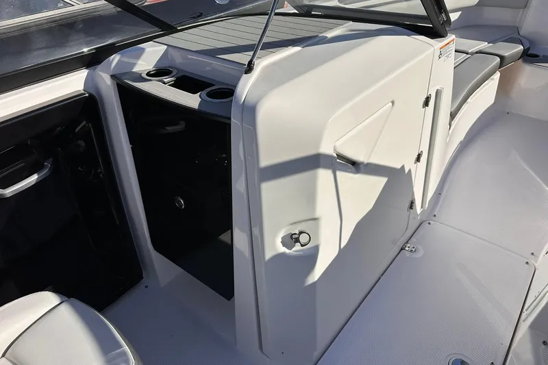 Slide: The Image of 2025 Yamaha Boats AR250 interior with seating and storage compartments. - 11