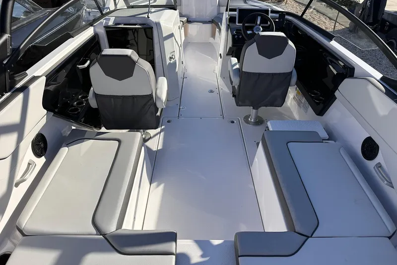 Slide: The Image of 2025 Yamaha Boats AR250 interior with modern seating and sleek design. - 17