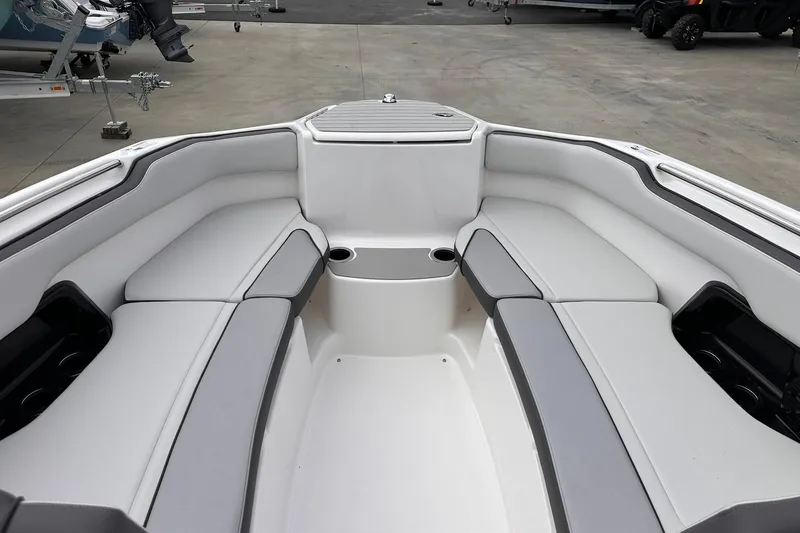 Slide: The Image of 2025 Yamaha Boats AR250 interior with spacious seating and cup holders. - 24