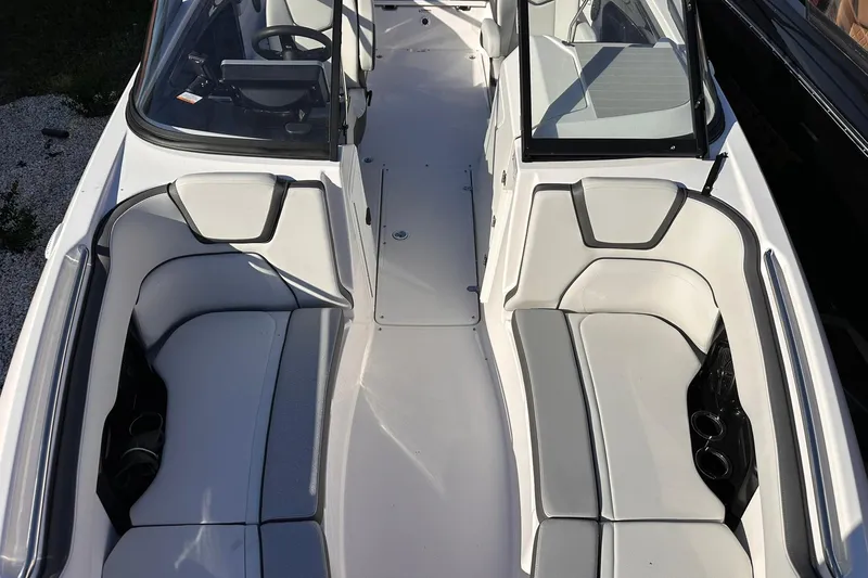 Slide: The Image of 2025 Yamaha Boats AR250 interior with sleek seating and modern design. - 26