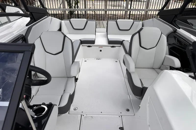 Slide: The Image of 2025 Yamaha Boats AR250 interior with modern seating and sleek design. - 27