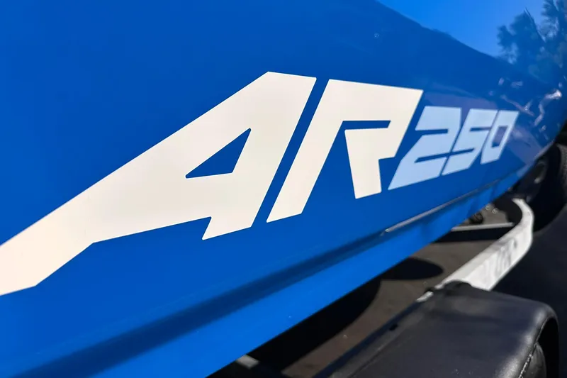 Slide: The Image of Close-up of 2025 Yamaha AR250 boat logo on blue hull. - 3