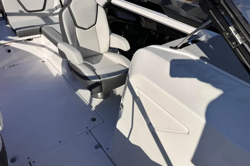 Slide: The Image of 2025 Yamaha Boats AR250 interior with modern seating and sleek design. - 5