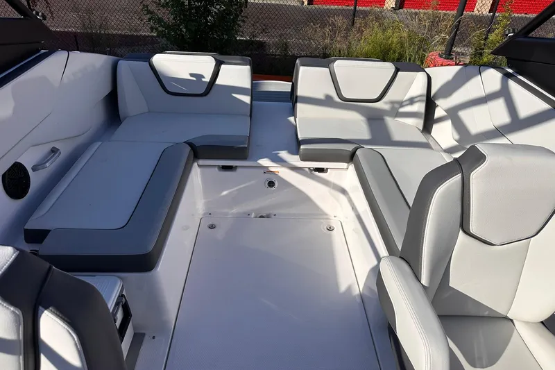 Slide: The Image of 2025 Yamaha Boats AR250 interior with modern seating and sleek design. - 6